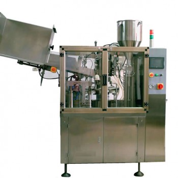 Tube filling and sealing machine